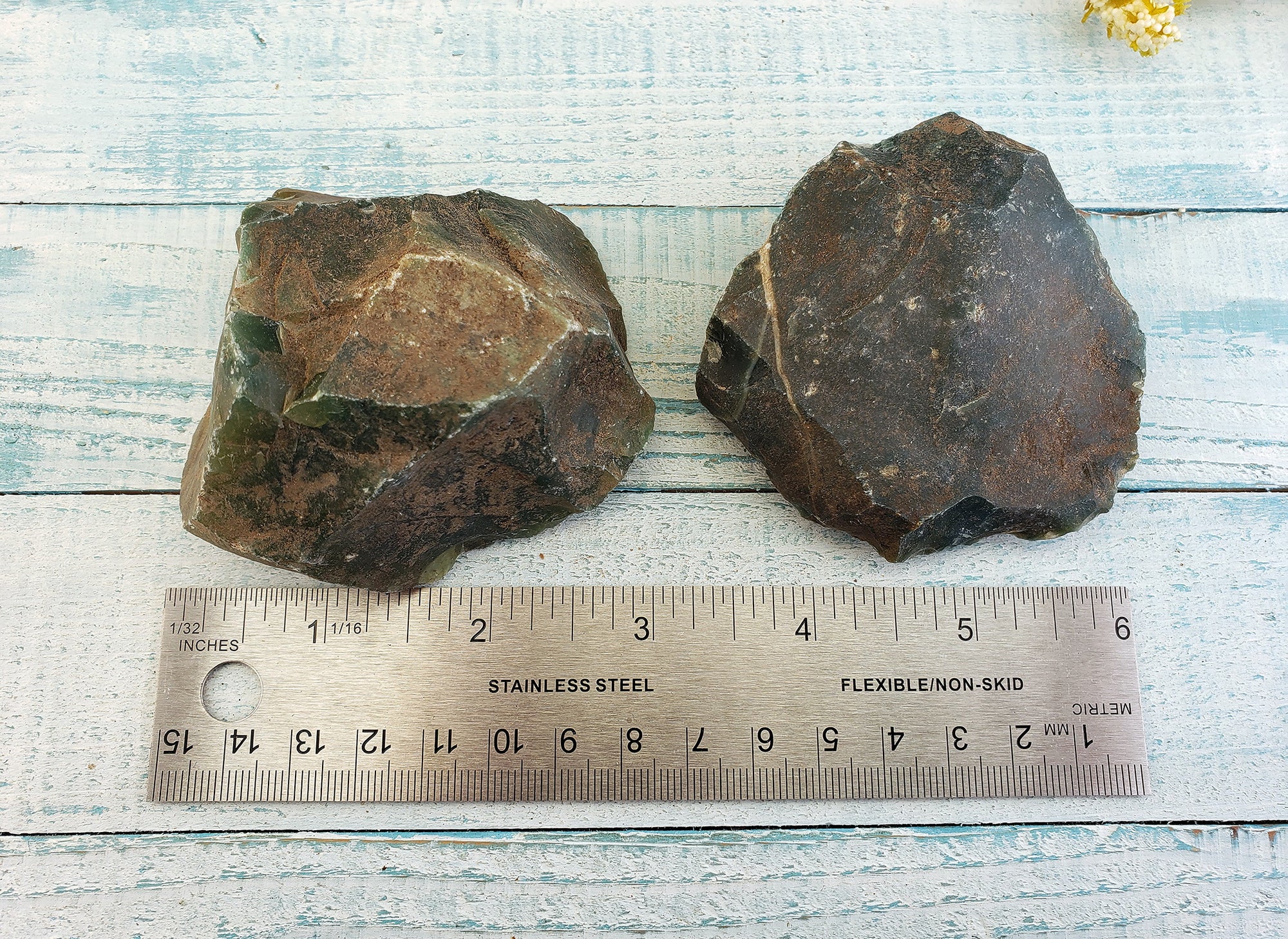 rough fancy jasper stones by ruler, showing estimate of size