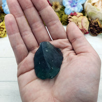 rough fluorite crystal in hand
