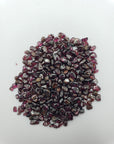 Garnet stone chips on white background