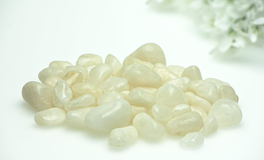 Milky quartz tumbled stones on display