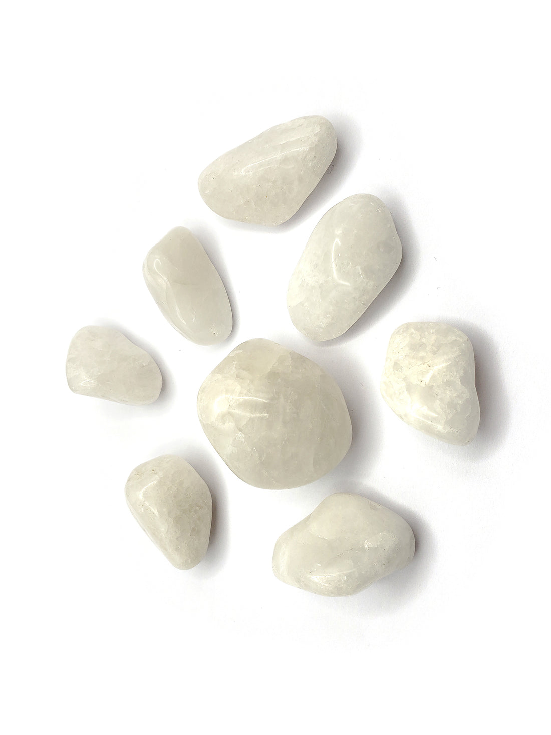 Milky quartz stone pieces on white background