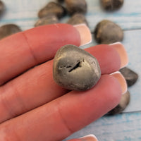 tumbled pyrite stone in hnd