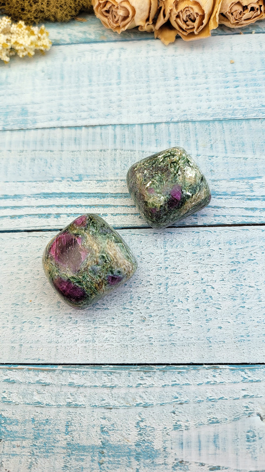 tumbled ruby kyanite fuchsite stones on display