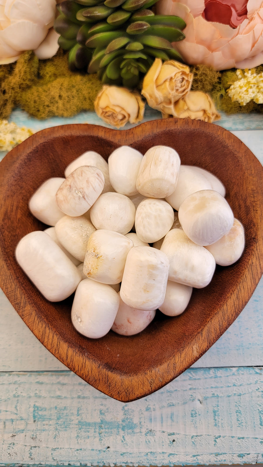 tumbled scolecite stones in wooden heart bowl