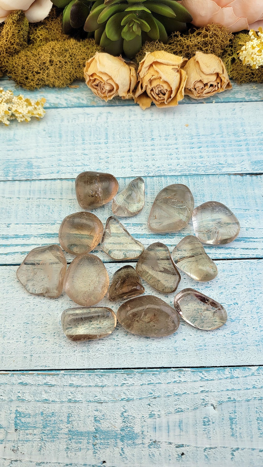 tumbled smoky quartz stones on display