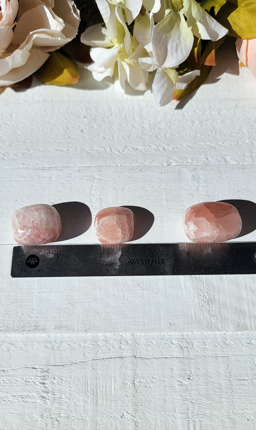 ruler with tumbled rose calcite for comparison
