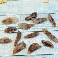 rough cacoxenite stones on display