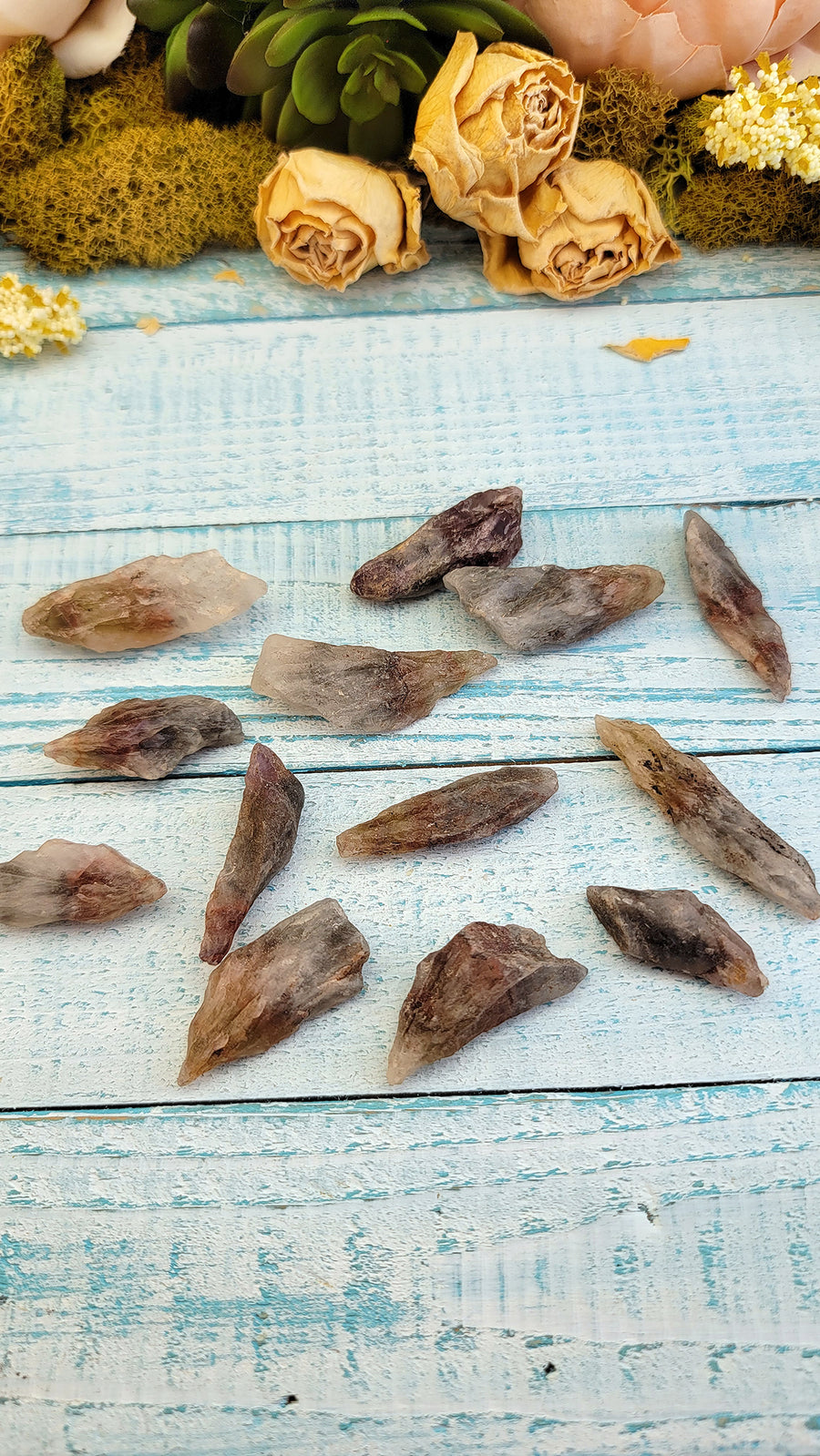 rough cacoxenite stones on display