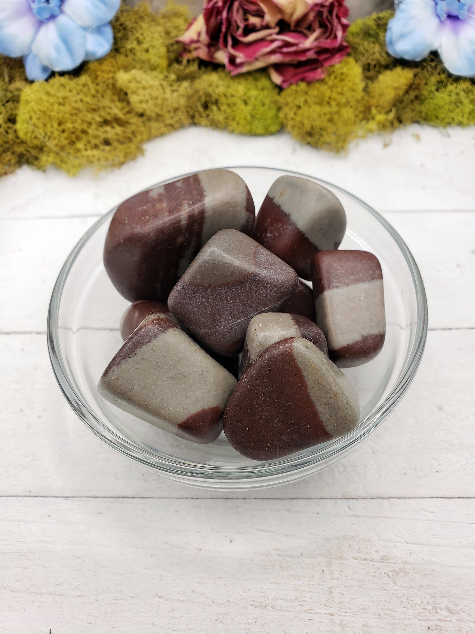 shiva lingam stone pieces in glass bowl
