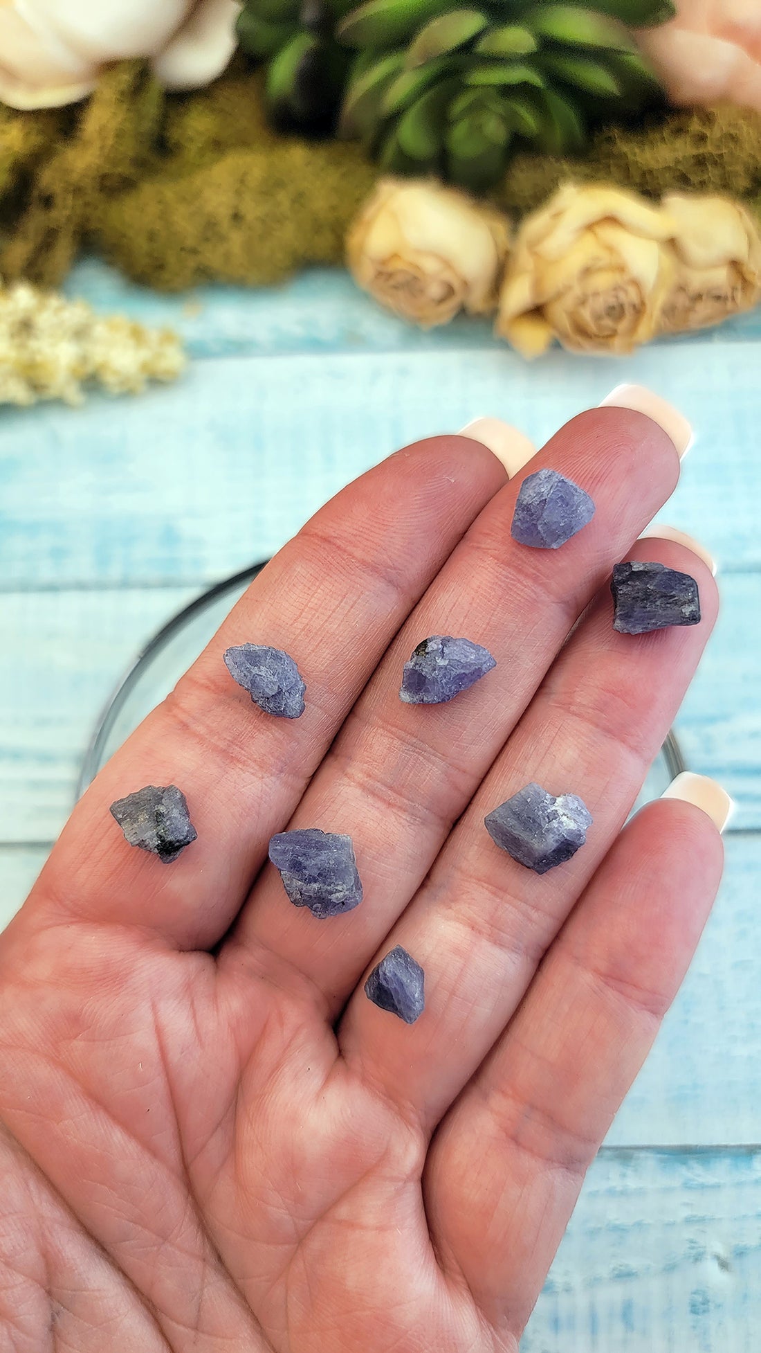 rough tanzanite stones on hand