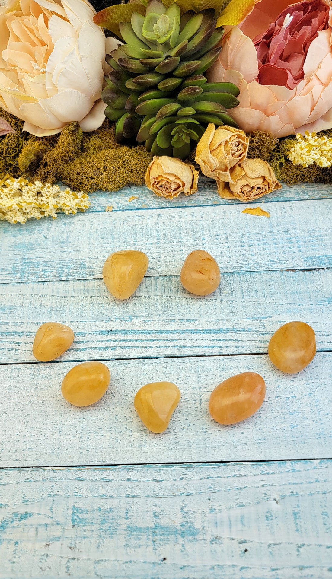 tumbled yellow aventurine stones placed to make a happy face