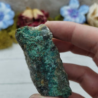 video of rough chrysoprase stone in hand, showing off various sides