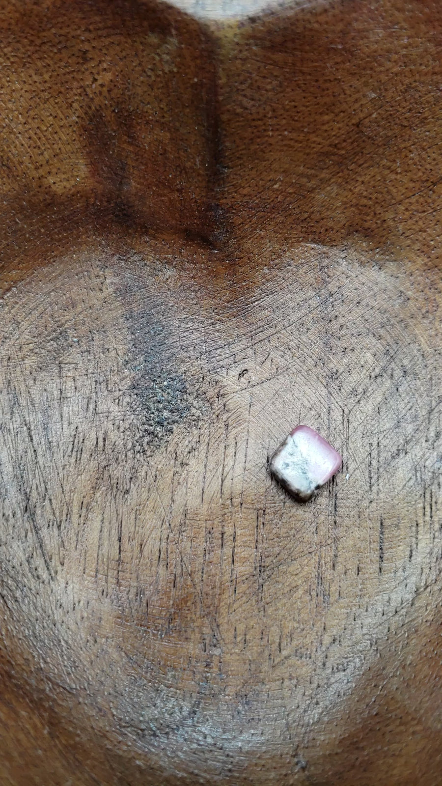Video of rhodonite chips being poured into a bowl