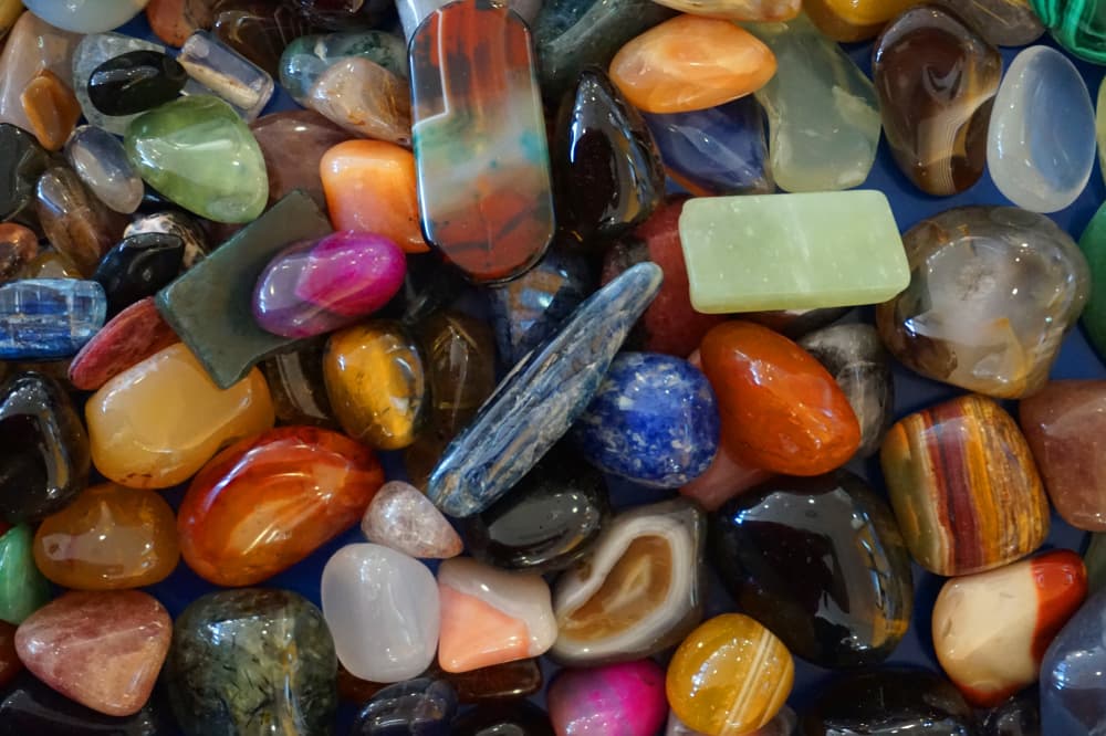 Bags of coloured stones on sale