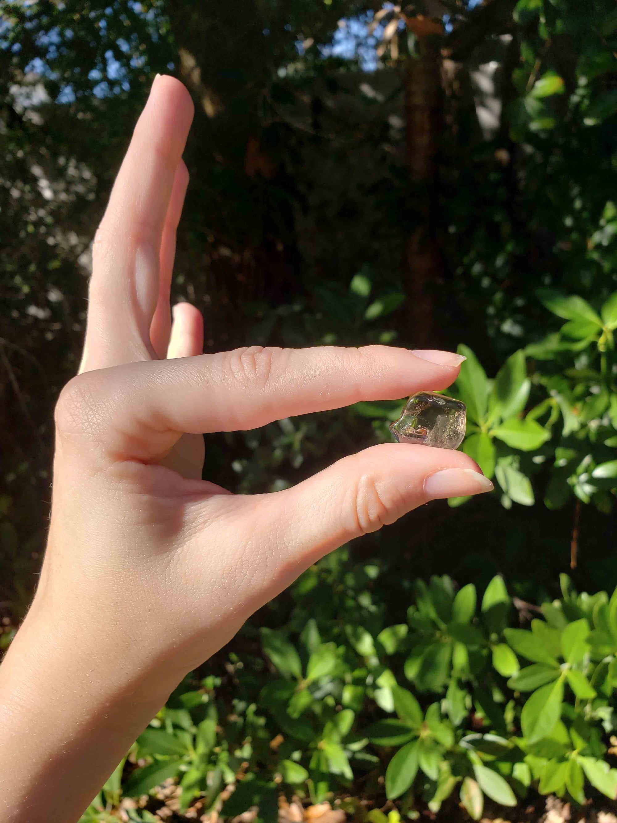 Pale Smoky Quartz Tumbled Gemstone - Mini One Stone in Hand Outdoors