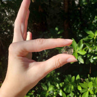 Pale Smoky Quartz Tumbled Gemstone - Mini One Stone in Hand Outdoors